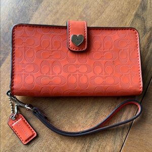 Coach Embossed Orange Wristlet